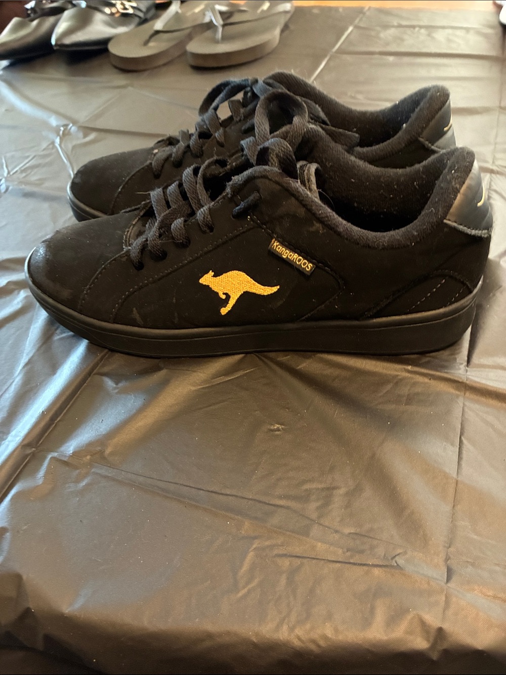 kangaROOS Black Sneakers with Gold Kangaroo Accent